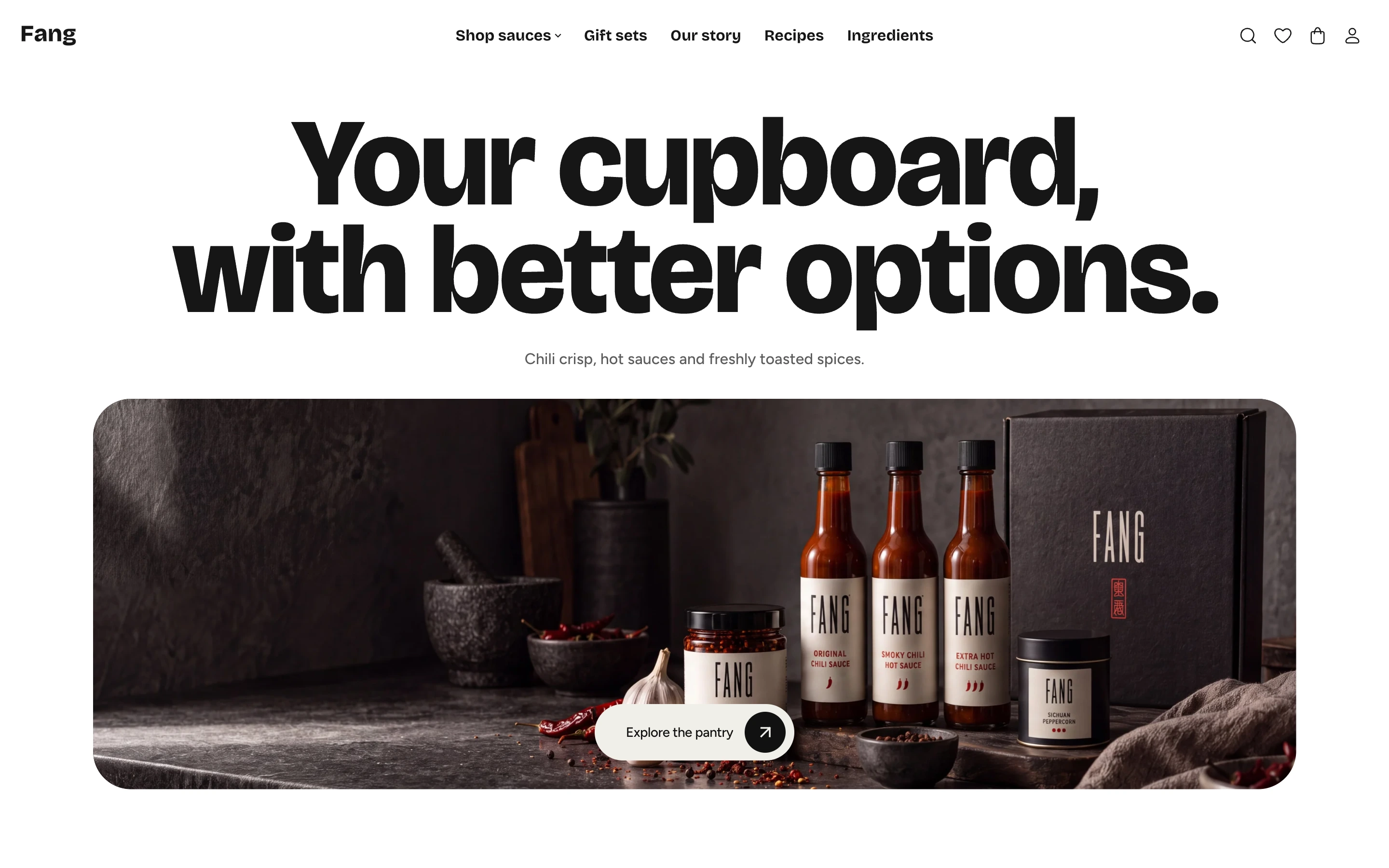Home page of the Fang style, a hot sauce maker's store, with a heavy centered heading over a wide photo of sauce bottles
